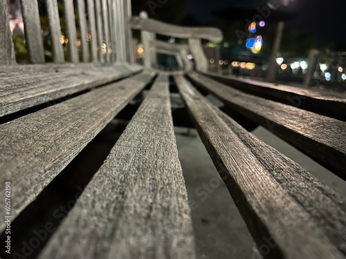 looking down the planks of a wood park bench