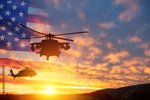 Silhouettes of helicopters on background of sunset with a transparent American flag. Greeting card for Veterans Day, Memorial Day, Air Force Day. USA celebration.