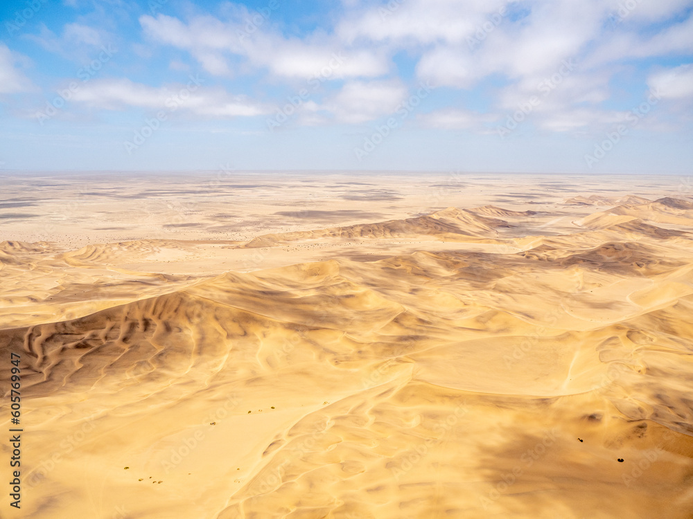 Aerial view of Namib Desert as it meets the Atlantic Ocean along the Skeleton Coast of Namibia.