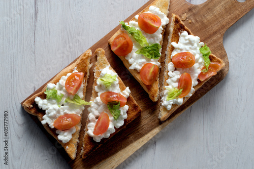 Toast with fresh cottage cheese and cherry tomato