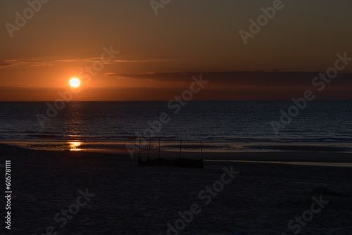 Landscape Sunset on the sea. Almost dark Deserted sandy beach. Place for text