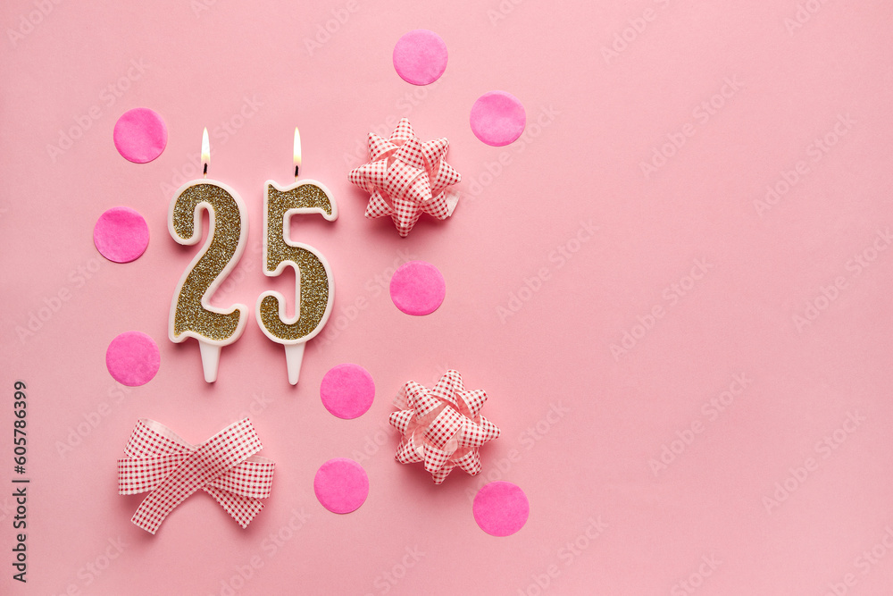 Number 25 on pastel pink background with festive decor. Happy birthday candles. The concept of celebrating a birthday, anniversary, important date, holiday. Copy space. Banner Number 25 on pastel pink background with festive decor. Happy birthday candles. The concept of celebrating a birthday, anniversary, important date, holiday. Copy space. Banner