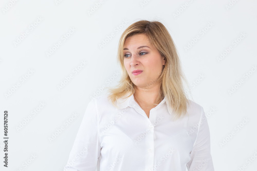 Woman with disgust emotion on white background with copy space and empty space for text Woman with disgust emotion on white background with copy space and empty space for text