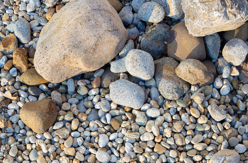 Sea stones of different sizes close-up.