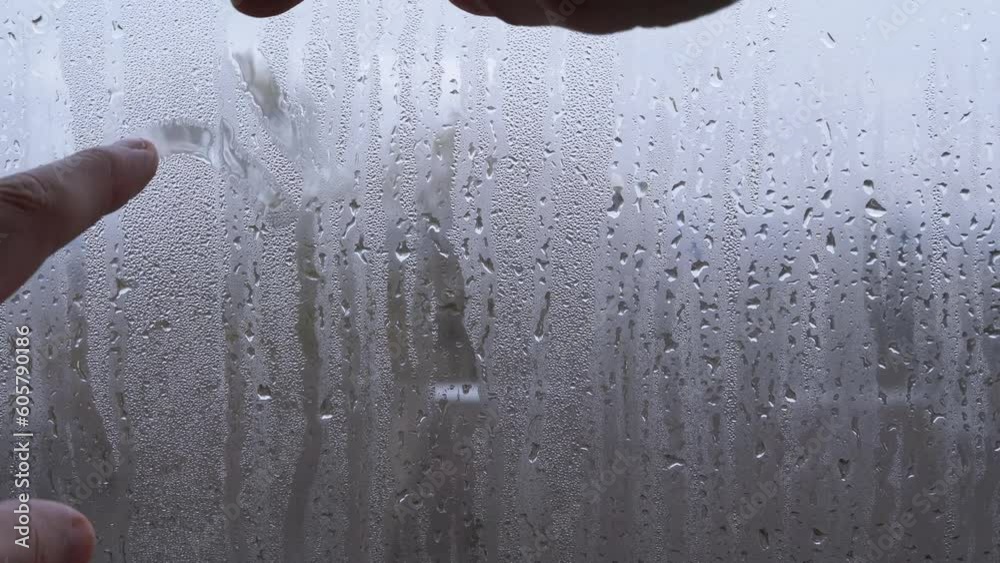 Vidéo Stock Woman Hands Drawing with Fingers Two Hearts on a Wet