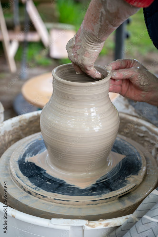 Making of mud pot on potters wheel during workshop outdoor Making of mud pot on potters wheel during workshop outdoor
