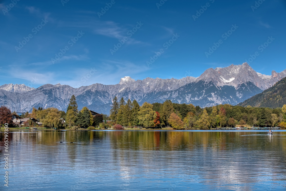 Fototapeta premium The lake of Zell am See in autum. Alpine landscape in fall. Salzburger Land in Austria