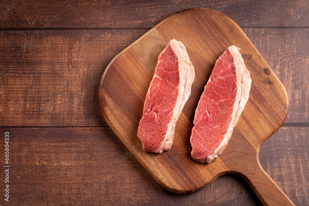 Raw picanha steak on the cutting board.