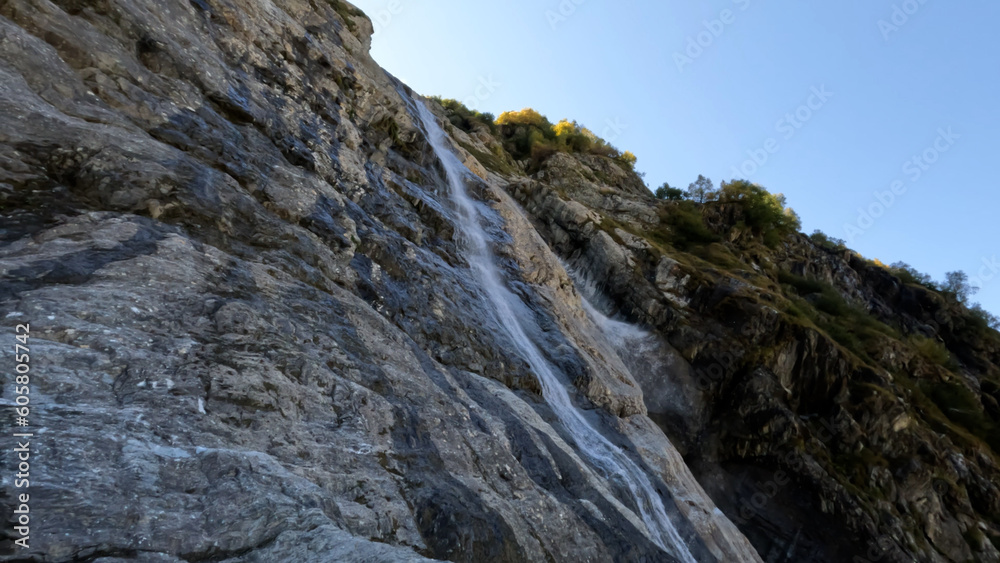 beautiful mountain ridge highland fast waterfall at summertime day - photo of nature