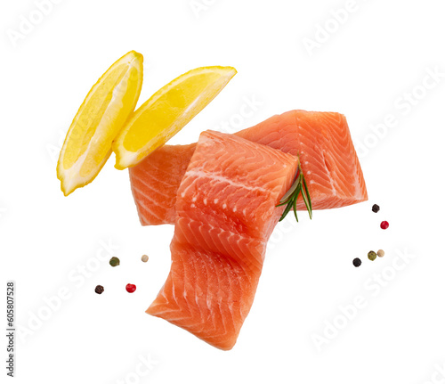 A raw piece of red fish fillet (trout, salmon) with a slice of lemon isolated on transparent background pngd. seafood with pepper mix 