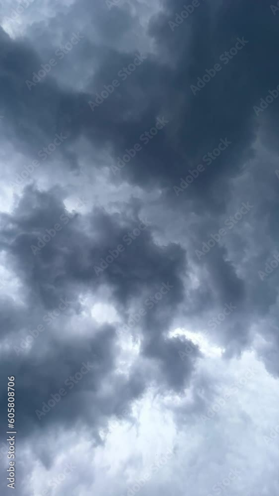 Dramatic time-lapse of moving white clouds in stormy sky. Timelapse of dynamic cloudscape in dramatic sky, vertical video Dramatic time-lapse of moving white clouds in stormy sky. Timelapse of dynamic cloudscape in dramatic sky, vertical video