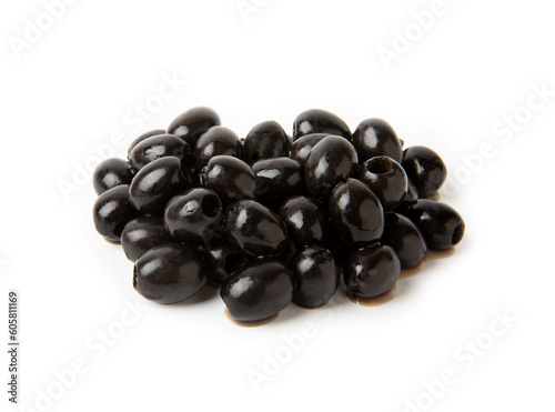 Tasty black olives with leaves isolated on white background. Fresh fruit olives on a white background.