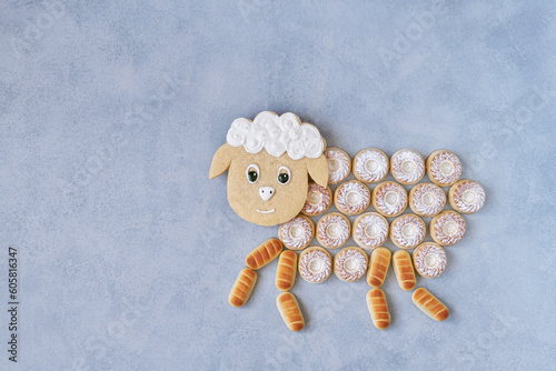 Semolina cookies maamoul arranged in shape of sheep. Traditional Muslim holiday. Eid al Adha concept background