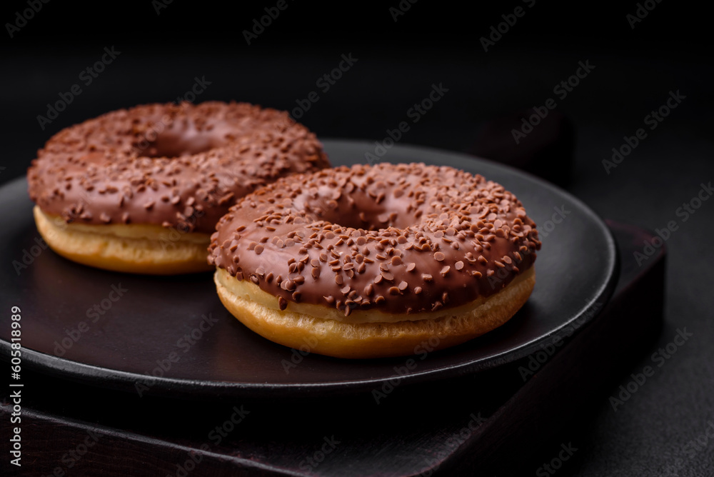 Delicious chocolate glazed donut sprinkled with chocolate chips