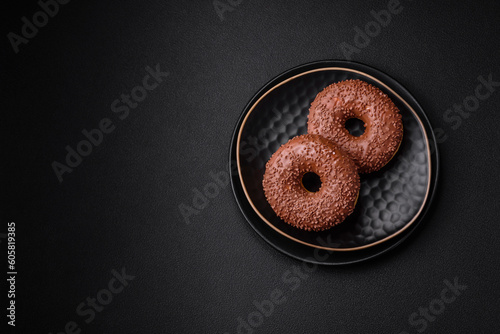 Delicious chocolate glazed donut sprinkled with chocolate chips