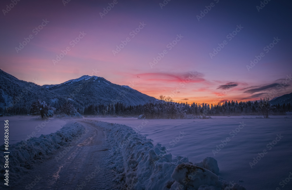 Sunset view Tressdorf and Troepolach on the border between Italy and Austria. Nassfeld ski resort in 5km. January 2022