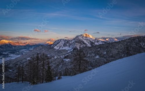 Alpenglow at sunset time on mountain peak at Nassfeld ski resort, Carinthia, Austria. January 2022