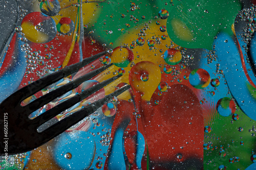 Abstract photography. Color spots are red, blue, yellow, green, black, white, silvery. Drops, objects on the surface. Photos for the background, for design, for interior design.