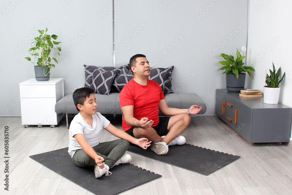 Latino father and son practice yoga, a traditional spiritual, physical and mental discipline in calm and relaxation to improve self-esteem, learn to appreciate their strengths and weaknesses
