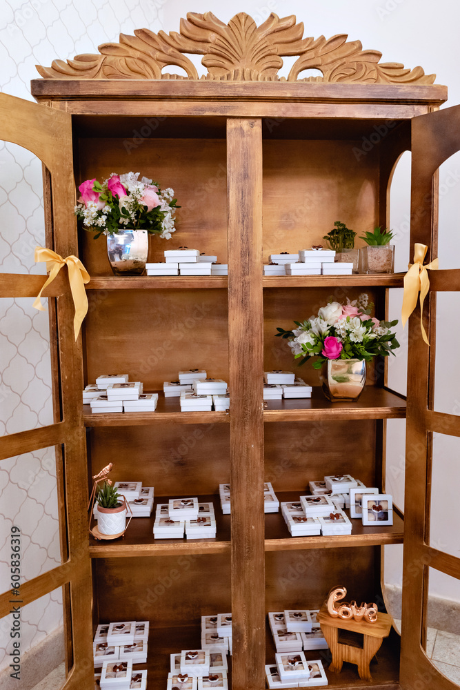 a wooden cabinet with a glass door with wedding decor and just married inside a wooden cabinet with a glass door with wedding decor and just married inside
