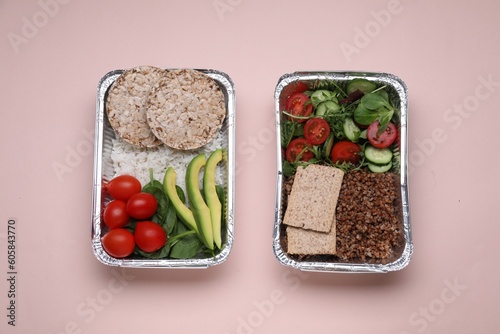 Containers with different fresh products on pink background, flat lay