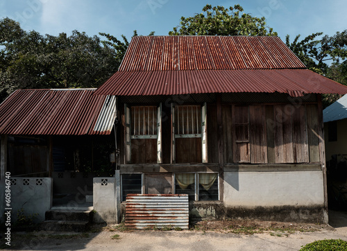 Ancient traditional wooden Malay house. An exciting glimpse into traditional Malaysian culture and architecture.