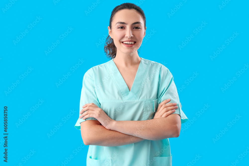 Female medical assistant on light blue background Female medical assistant on light blue background