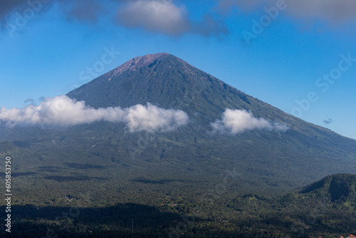 Bali, Indonesia Clouds passing by the Mount Agung volcano at the Lempuyang temple.