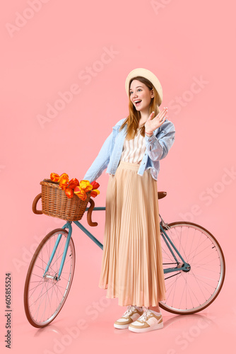 Young woman with bicycle on...