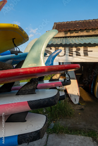Fototapeta Naklejka Na Ścianę i Meble -  Canggu, Bali, Indonesia Surfboards piled onto a truck at the beach.