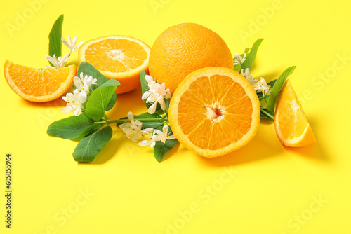 Fototapeta Naklejka Na Ścianę i Meble -  Blooming branches with oranges on yellow background