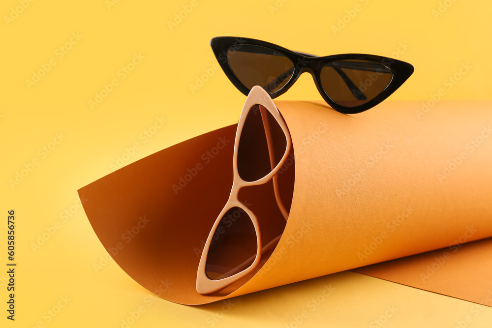 Stylish sunglasses on color background Stylish sunglasses on color background