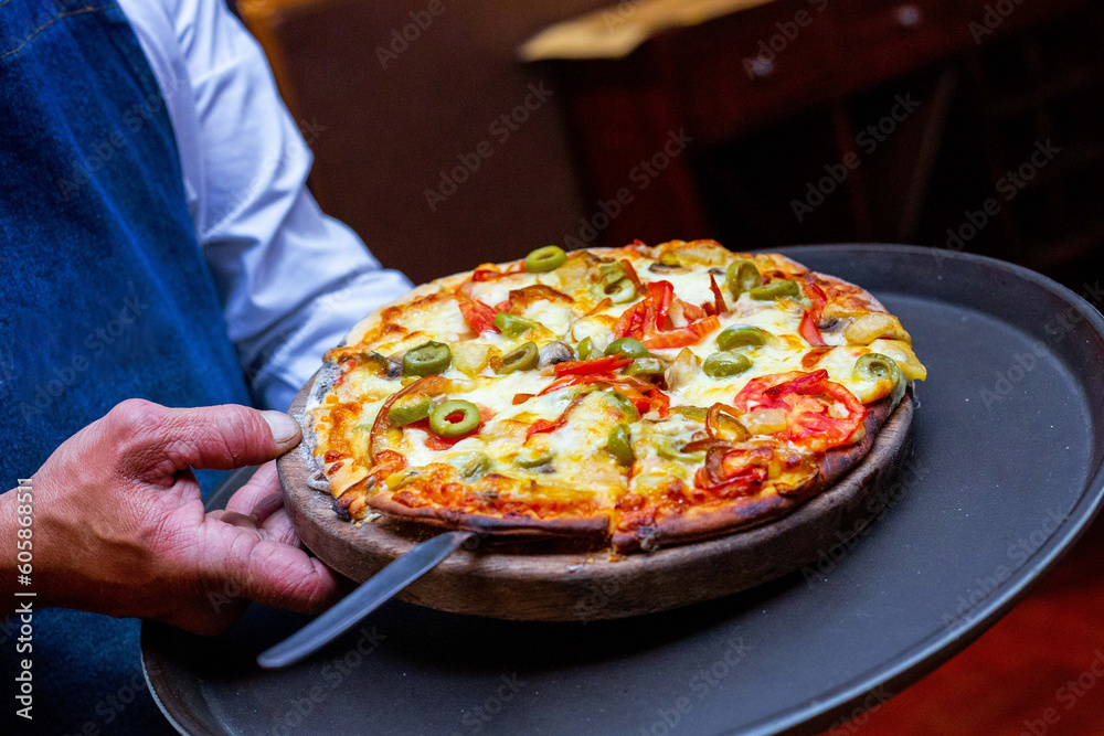 person holding pizza