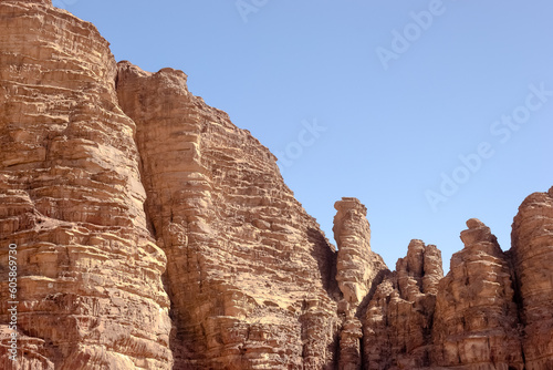 Scenic vista of Wadi Rum (Valley of the Moon) desert in southern Jordan, showcasing its striking red sand dunes, magnificent sandstone formations, and rugged granite rock landscapes. 