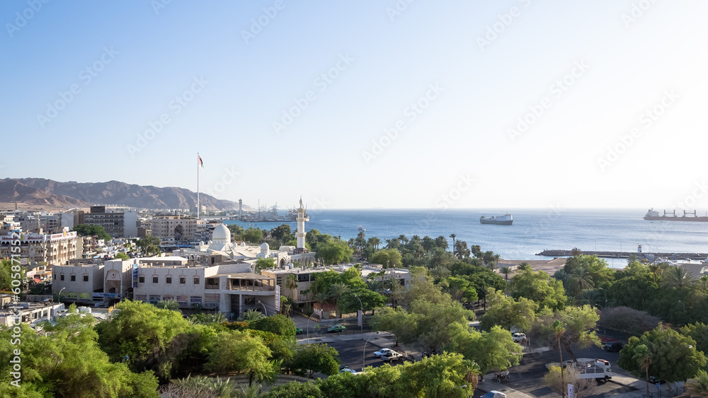 Sunny afternoon at Aqaba beach, Jordan's gateway to the Red Sea. Aqaba is renowned for its stunning coastline, crystal-clear waters, and vibrant marine life.