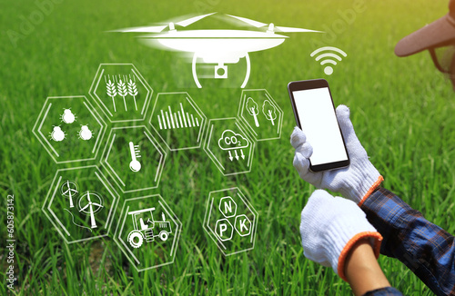 Modern farmers use technology to maintain and manage their farms. Smart farmer concept. photo