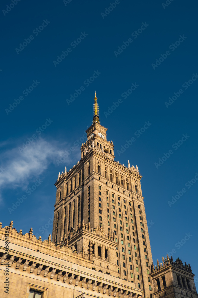 The Palace of Culture and Science Beautiful architecture of Warszawa city center with Palace of Culture at sky background. One of the main symbols of Warsaw skyline. Travel destinations tourist The Palace of Culture and Science Beautiful architecture of Warszawa city center with Palace of Culture at sky background. One of the main symbols of Warsaw skyline. Travel destinations tourist