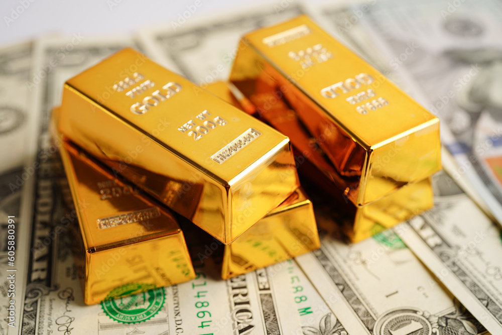 Gold bars on US dollar banknote money, finance trading investment business currency concept. Gold bars on US dollar banknote money, finance trading investment business currency concept.