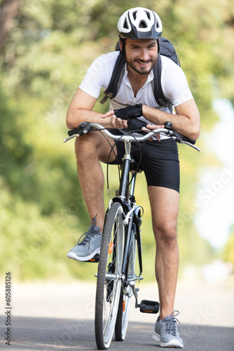 Fototapeta Naklejka Na Ścianę i Meble -  a male cyclist rides a bicycle