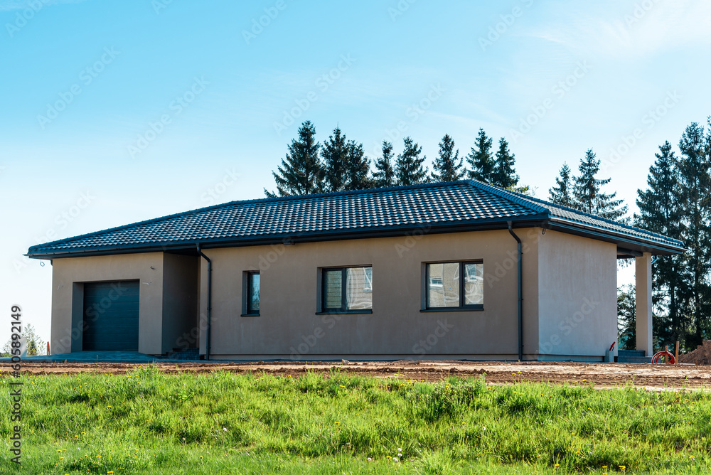 New modern house just built not yet installed,external view.Summer day. New modern house just built not yet installed,external view.Summer day.