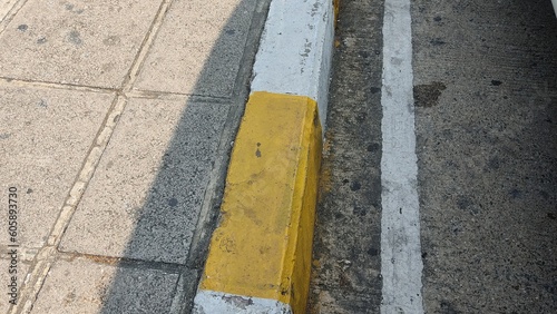 yellow lines on asphalt © Boontian
