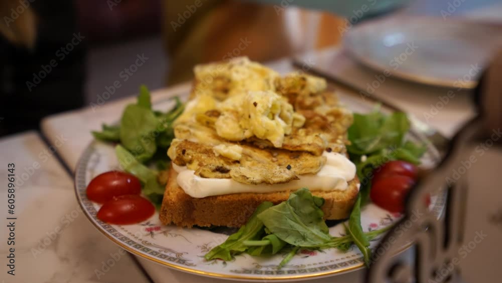 Healthy breakfast egg toast served with tomato, vegetables, cream cheese and white bread Healthy breakfast egg toast served with tomato, vegetables, cream cheese and white bread