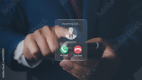 Obraz na plátně Man answering to incoming from an unknown caller