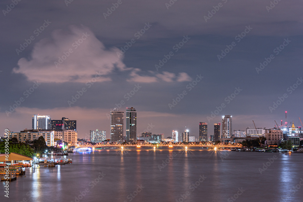 Fototapeta premium Long exposure night land scape at rama VIII bridge, the famous suspension bridge in Thailand , Bangkok, Thailand