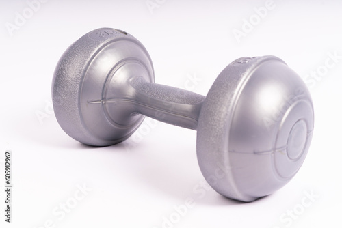 Grey dumbbell Side view closeup isolated on white background