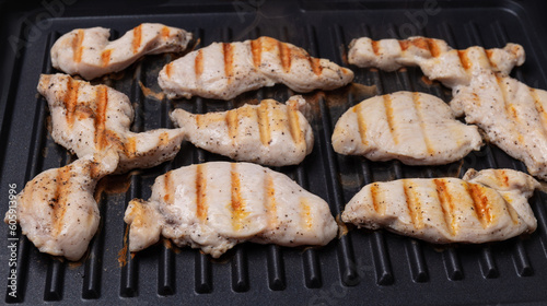 chicken breast cooked on an electric grill. Beautiful grilled chicken 