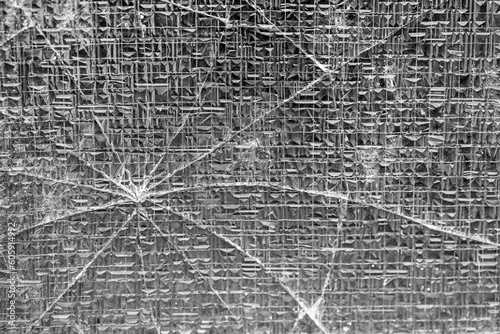 a broken glass pane with cracks