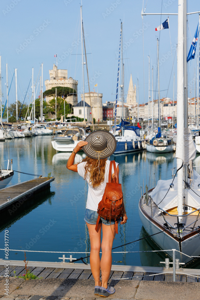 travel destination in La Rochelle,  vacation, summer holiday in France- Woman tourist on the port