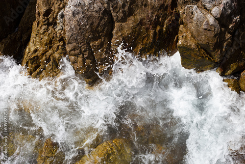 Sea water splashing on rocks
