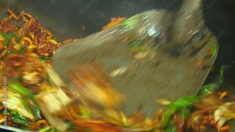 The process of frying the toppings for Krengsengan Rice, in Bahasa it called 